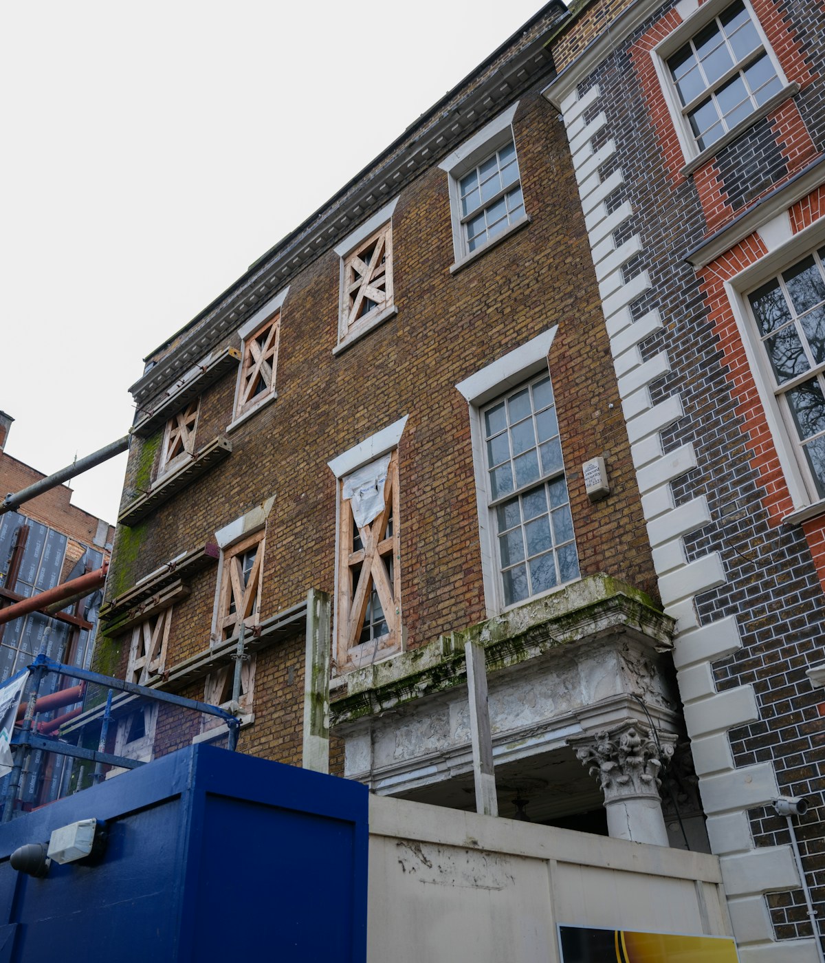UK brick property renovation with scaffolding